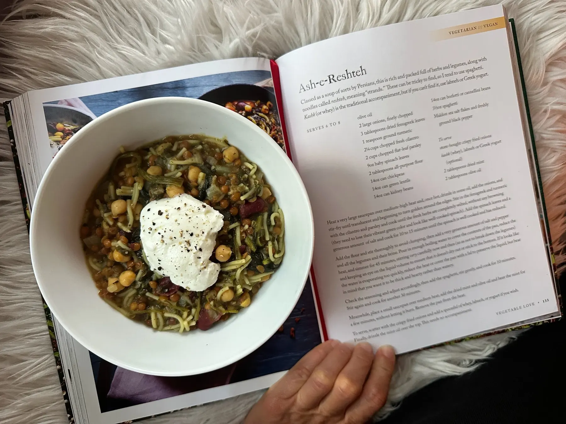 Shared table set with warm, cooked seasonal dishes